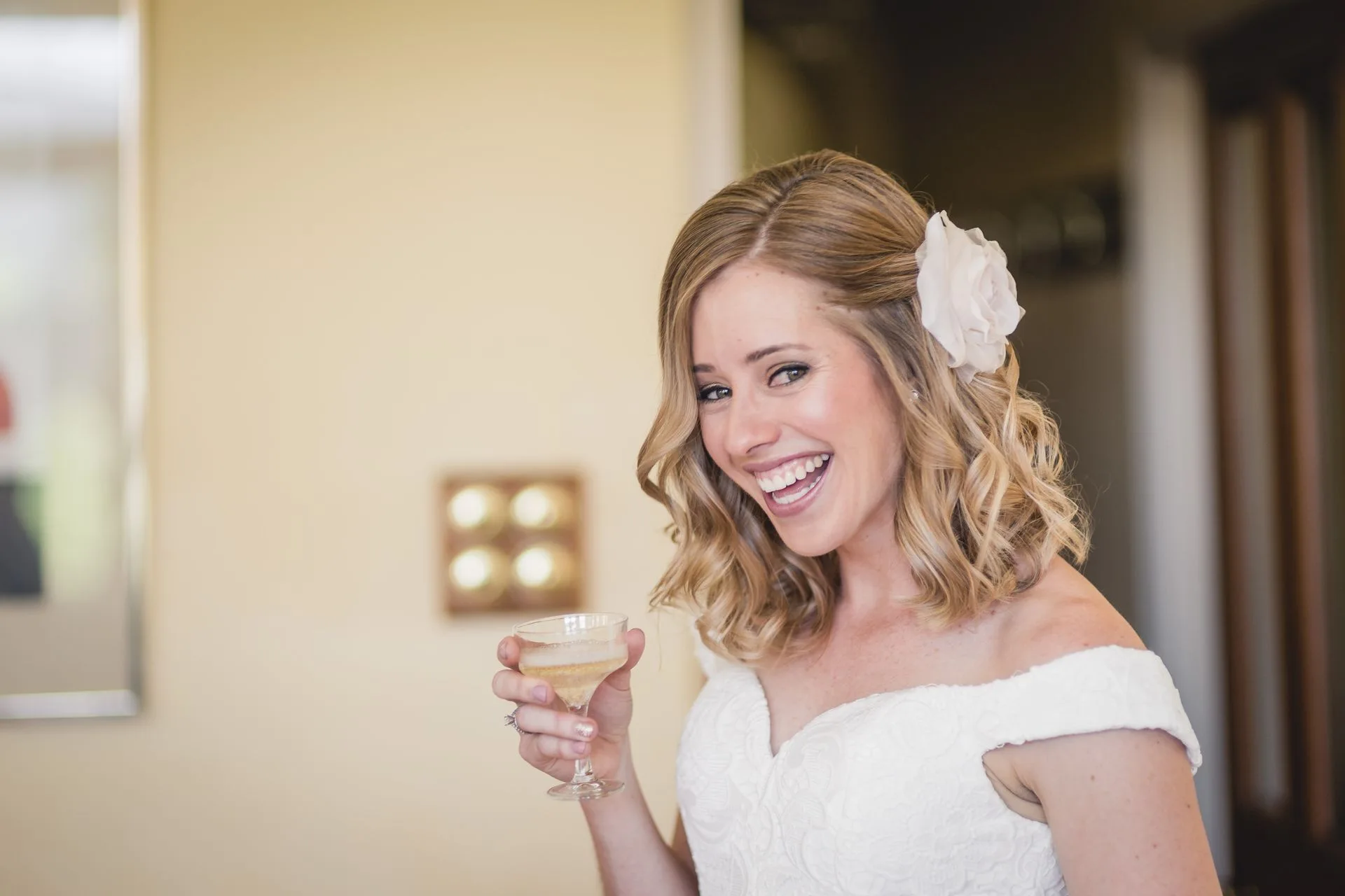 Bride with champagne on the wedding morning