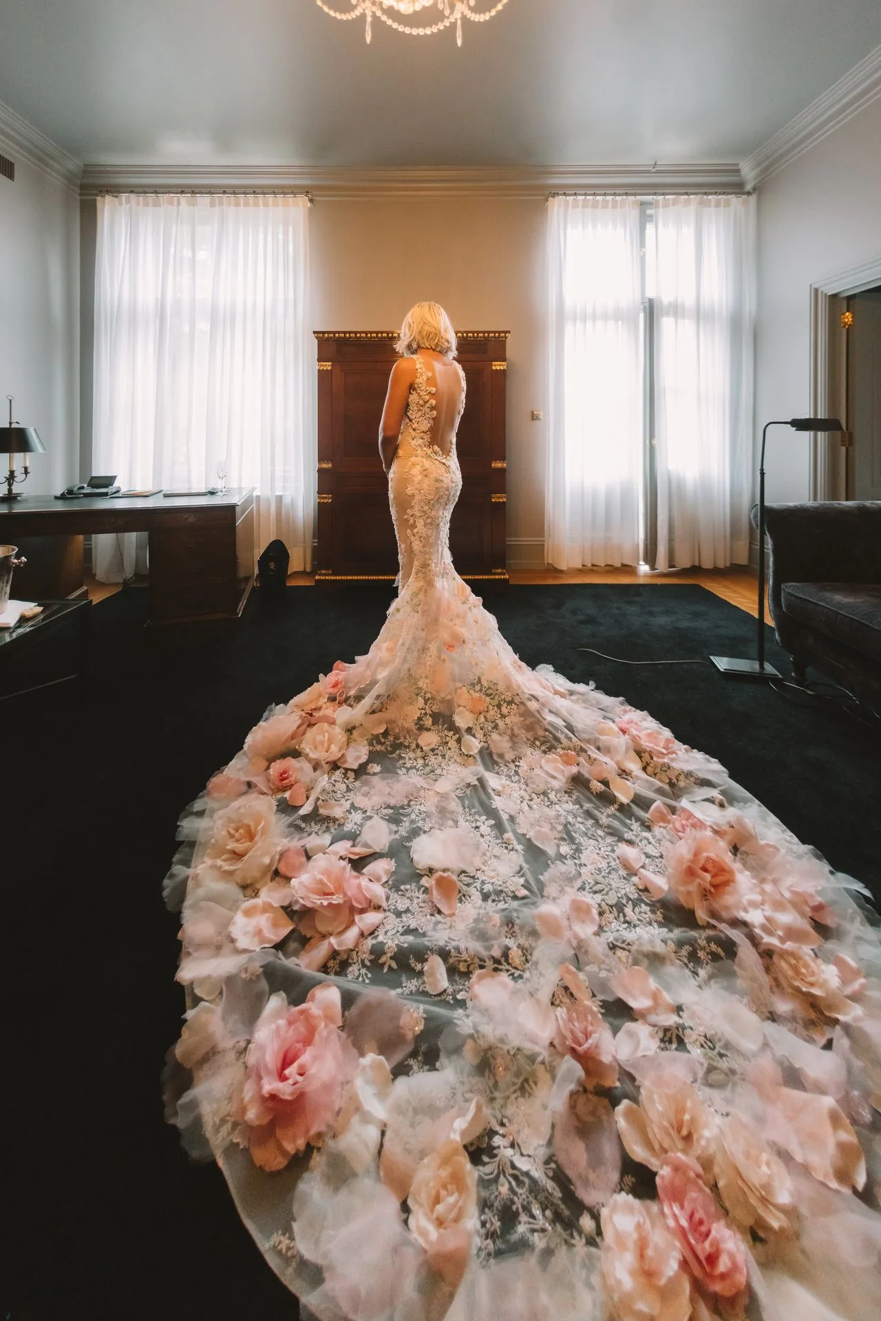 Bride getting ready by the window — planning a German wedding from abroad