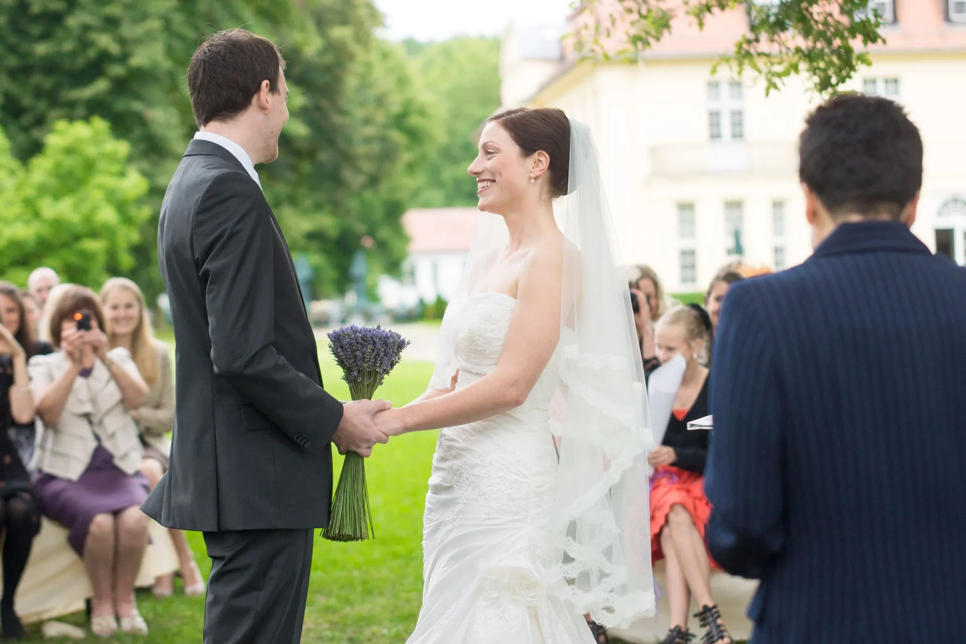 Early wedding 2012 — couple with lavender bouquet in front of a castle