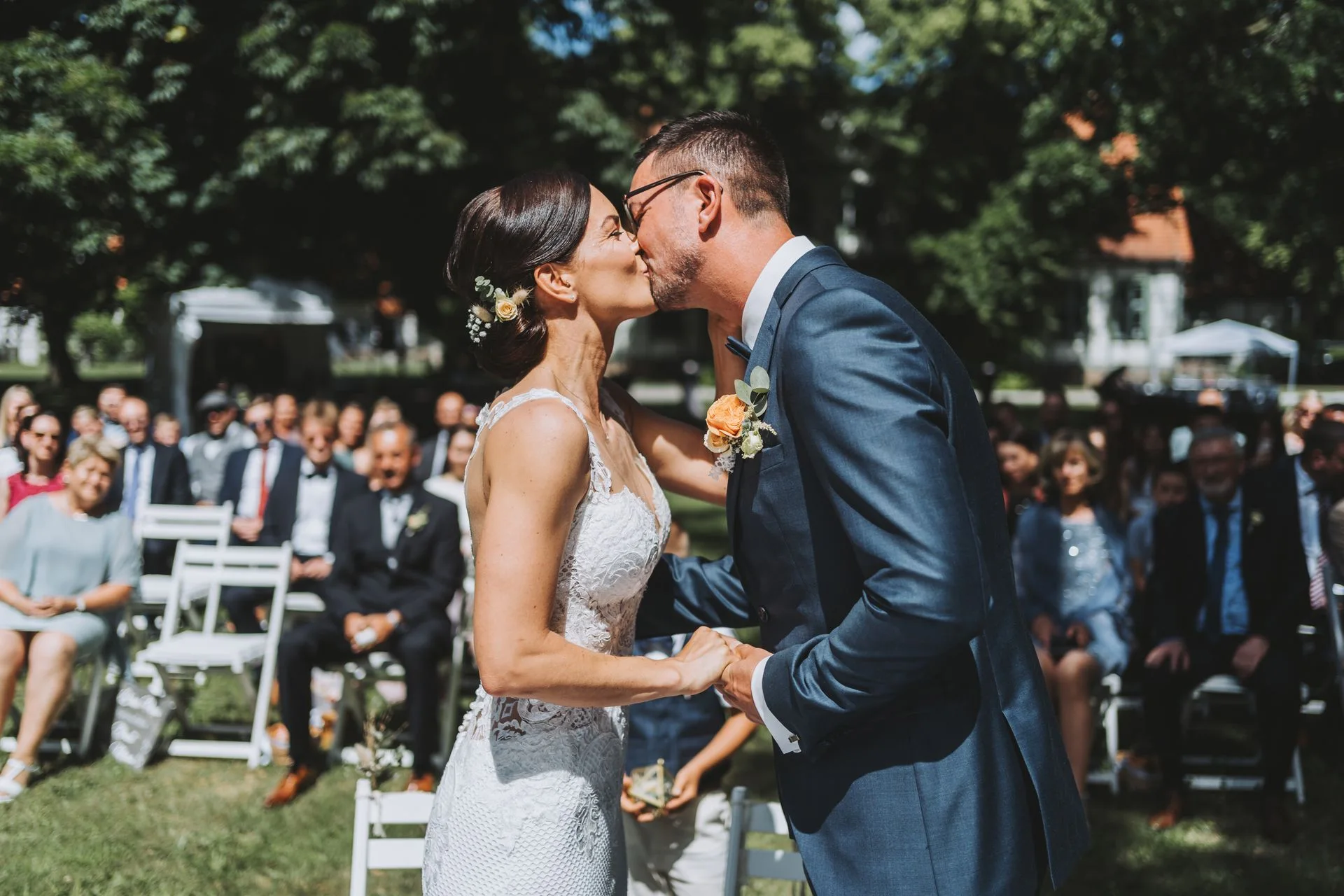 First kiss at an outdoor wedding ceremony in Germany