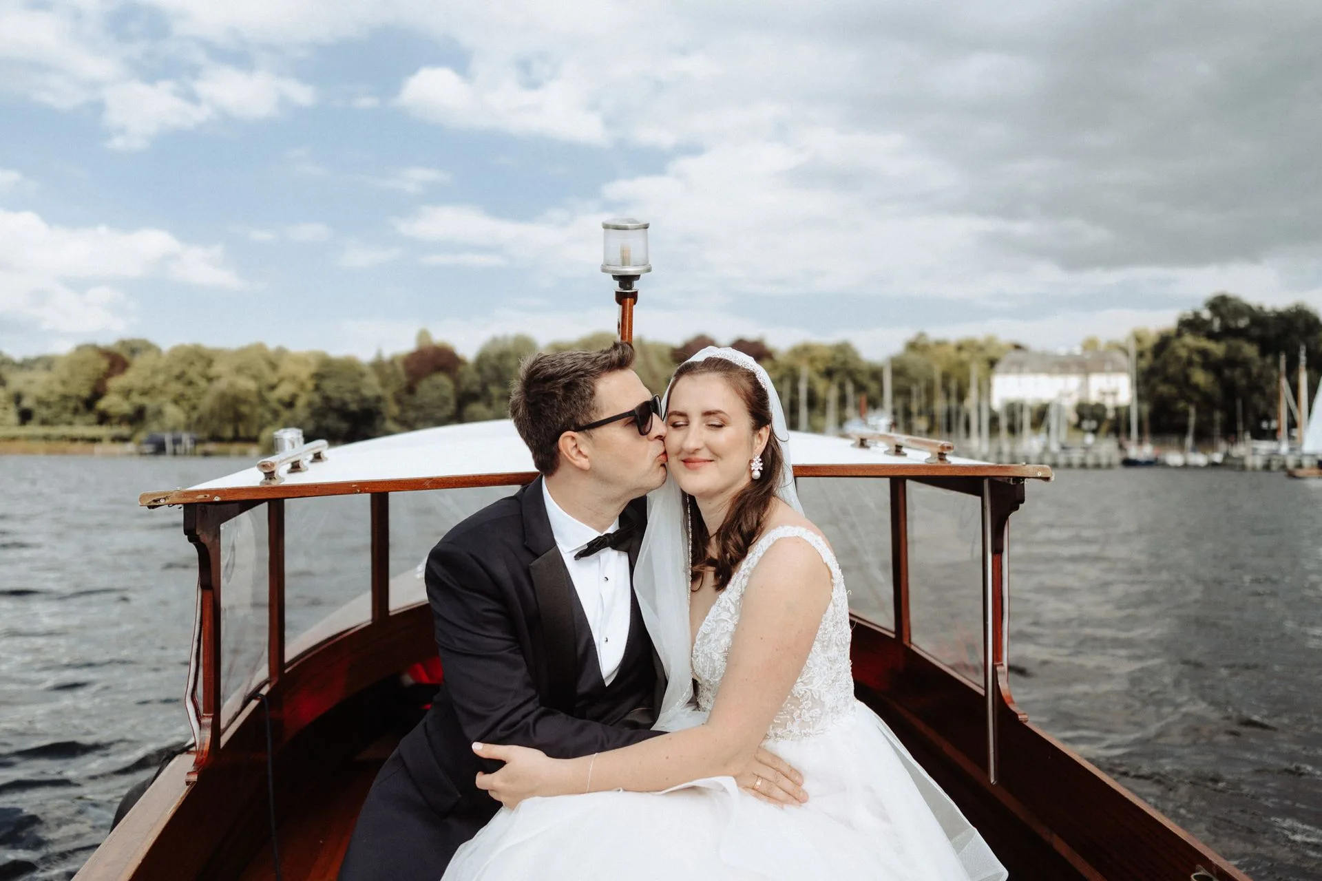 Couple in a wooden boat on still water
