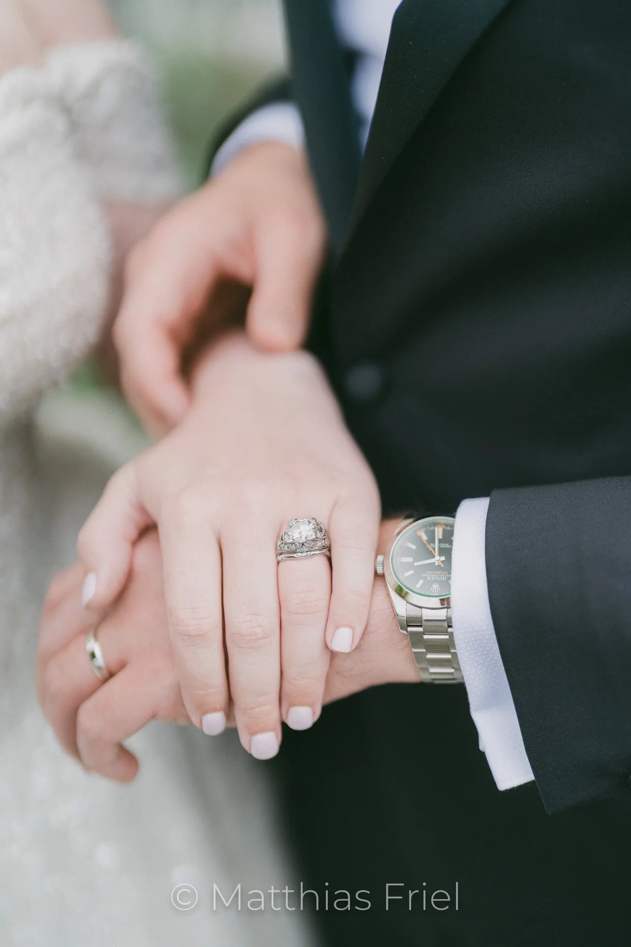 Detail of the couple's hands and rings at Petersberg wedding